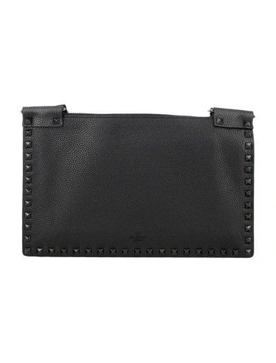 Shop Valentino Garavani Rockstud Flat Crossbody Bag In Black