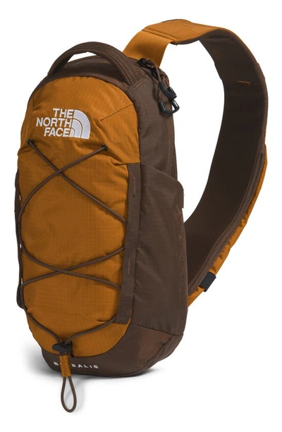 Shop The North Face Borealis Water Repellent Sling Backpack In Timber Tan/ Demitasse Brown
