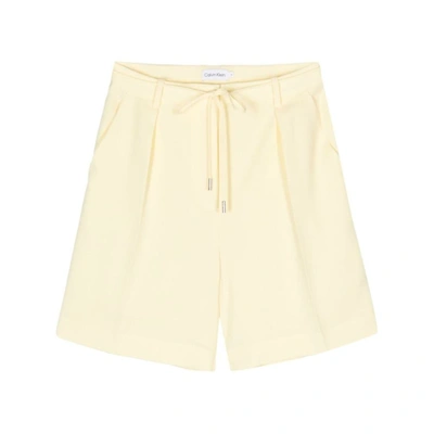 Shop Calvin Klein Shorts In Yellow