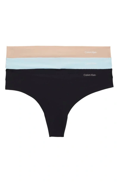 Shop Calvin Klein Invisibles 3-pack Thongs In Light Blue/ Black/ Cedar