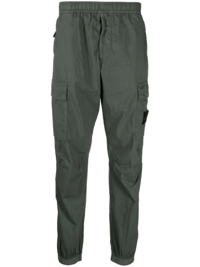 Shop Stone Island Trousers With Pockets In Green