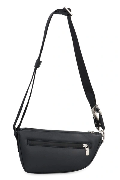 Shop Burberry Shield Leather Crossbody Bag In Black