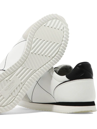 Shop Valentino Garavani Stud Around Leather Sneakers In White