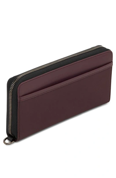 Shop Tumi Leather Zip Continental Wallet In Deep Plum