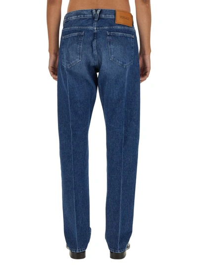 Shop Versace Regular Fit Jeans In Denim