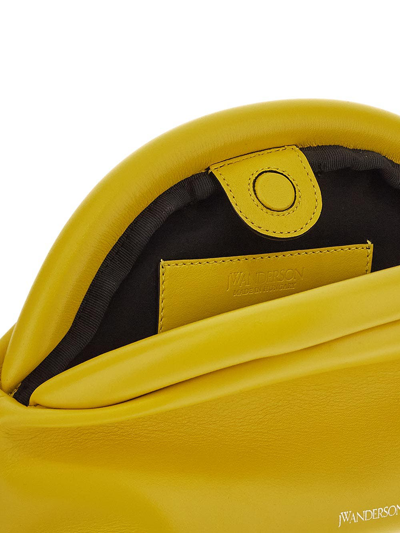 Shop Jw Anderson Bumper Clutch Bag In Yellow