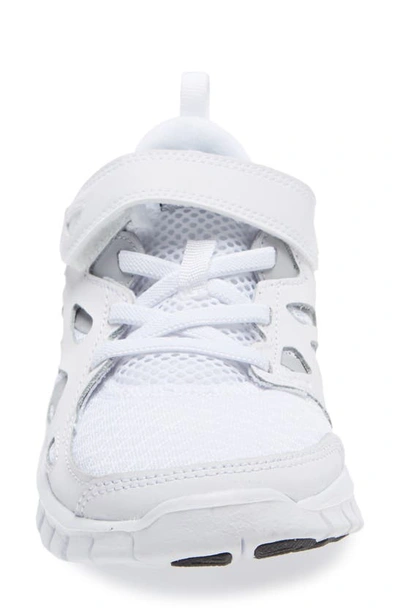 Shop Nike Kids' Free Run 2 Sneaker In White/ Black/ Wolf Grey