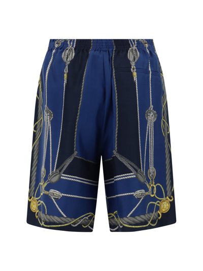 Shop Versace Shorts In Blue/gold