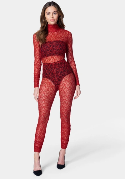 Shop Bebe Open Back Turtle Neck Lace Catsuit In Salsa