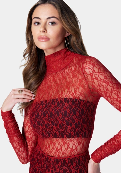 Shop Bebe Open Back Turtle Neck Lace Catsuit In Salsa