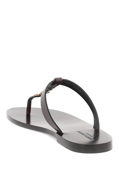 Shop Saint Laurent Cassandre Leather Flip-flop In Brown