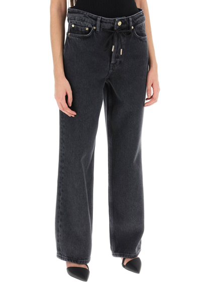 Shop Ganni Loose Jeans With Drawstring In Washed Blackblack (grey)