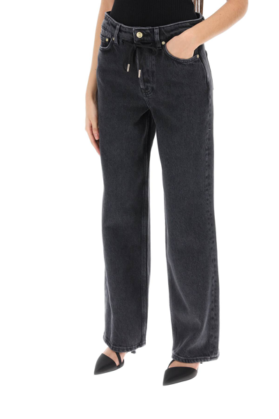 Shop Ganni Loose Jeans With Drawstring In Washed Blackblack (grey)