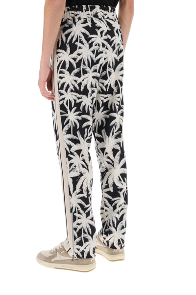 Shop Palm Angels Joggers With Palms Print In Black Off White (white)
