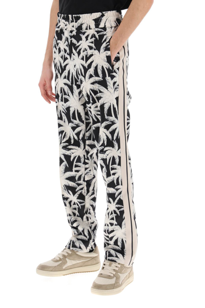Shop Palm Angels Joggers With Palms Print In Black Off White (white)