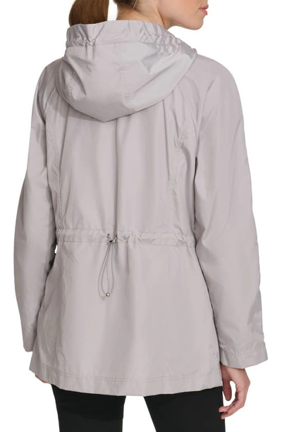 Shop Cole Haan Travel Packable Hooded Rain Jacket In Pearl
