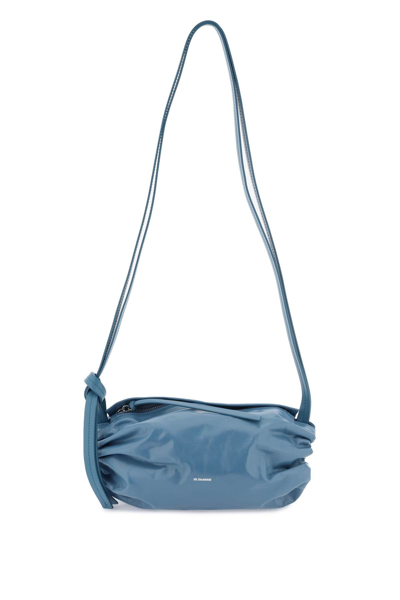 Shop Jil Sander Cushion Crossbody Bag In Canard (blue)