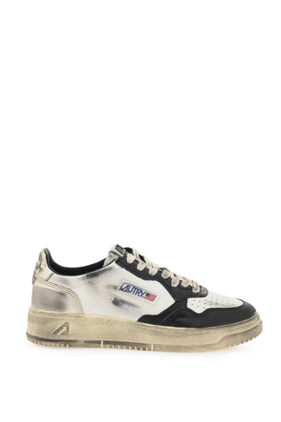 Shop Autry Medalist Low Super Vintage Sneakers In Wht Blk Plat (white)
