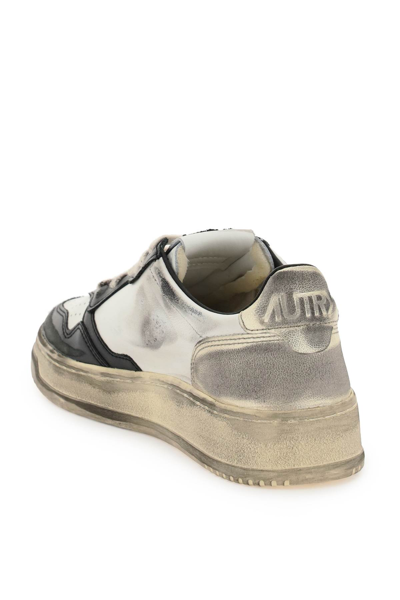 Shop Autry Medalist Low Super Vintage Sneakers In Wht Blk Plat (white)
