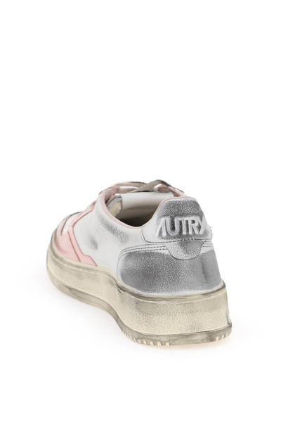 Shop Autry Medalist Low Super Vintage Sneakers In Wht Pow Silv (white)