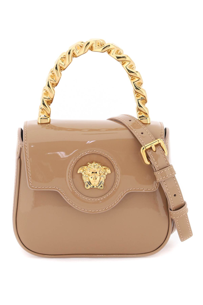 Shop Versace Patent Leather La Medusa Mini Bag In Blush  Gold (beige)