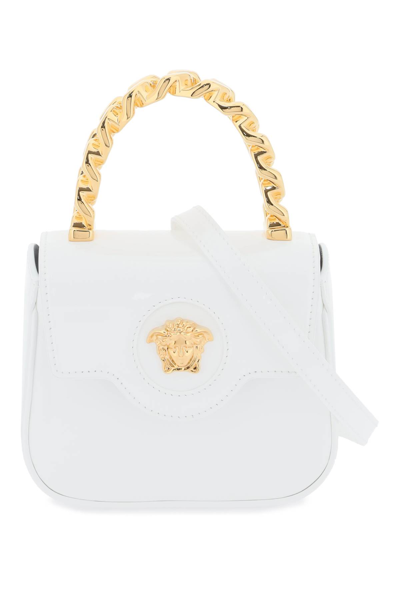 Shop Versace Patent Leather La Medusa Mini Bag In Optical White  Gol (white)