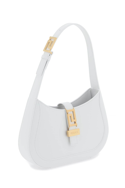 Shop Versace Greca Goddess Small Hobo Bag In Optical White  Gol (white)