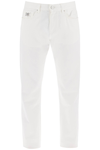 Shop Versace Medusa Regular Jeans In White (white)