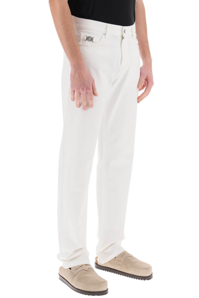 Shop Versace Medusa Regular Jeans In White (white)