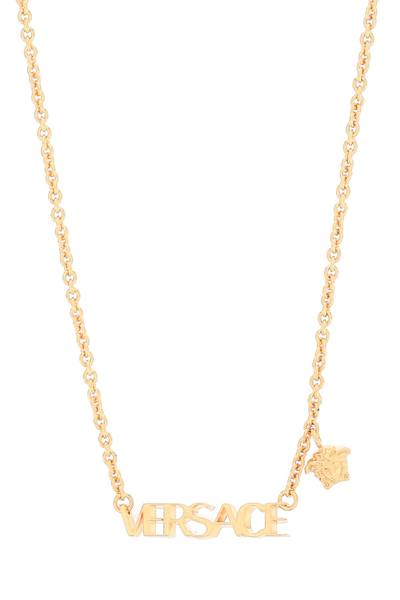 Shop Versace Lettering Logo Necklace In  Gold (gold)