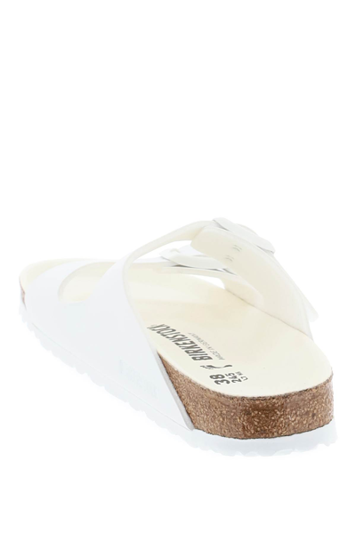 Shop Birkenstock Arizona Slides Narrow Fit In Triples White (white)