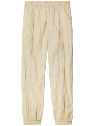 Shop Burberry Track Pants In Beige