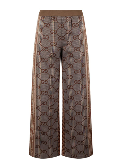 Shop Gucci Monogrammed Pants In Brown