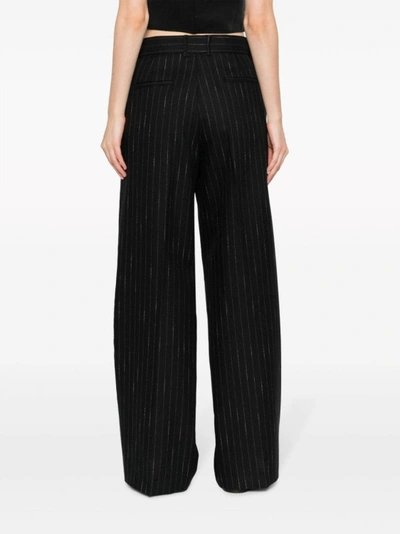 Shop Msgm Pinstripe-pattern Wide-leg Trousers In Black
