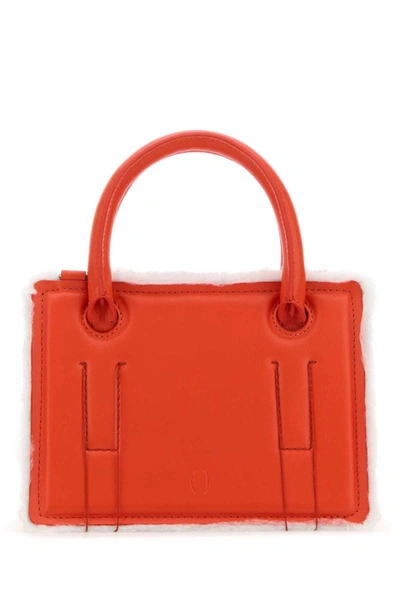 Shop Dentro Handbags. In Red
