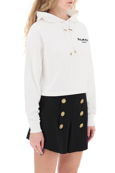 Shop Balmain Cropped Hoodie With Flocked Logo In White