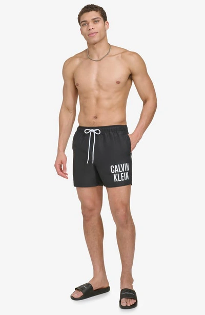 Shop Calvin Klein Modern Euro Upf 40+ Swim Trunks In Black