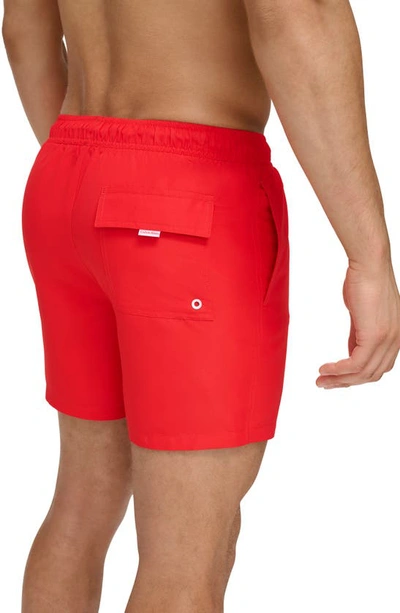 Shop Calvin Klein Ck Outline Repreve® Recycled Polyester Swim Trunks In Red