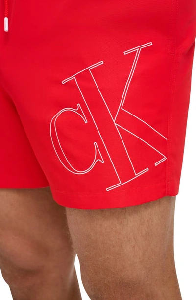 Shop Calvin Klein Ck Outline Repreve® Recycled Polyester Swim Trunks In Red