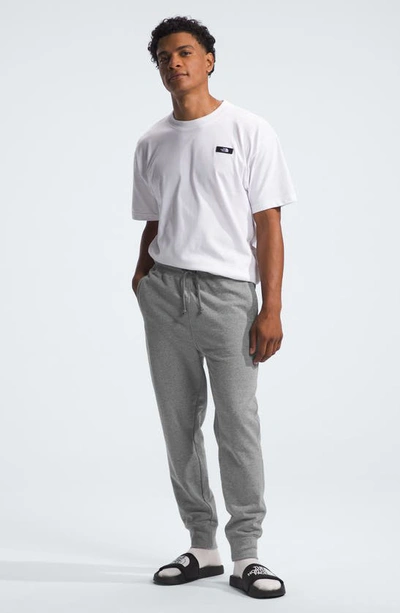 Shop The North Face Heritage Patch Jogger Sweatpants In Tnf Medium Grey Heather/ White
