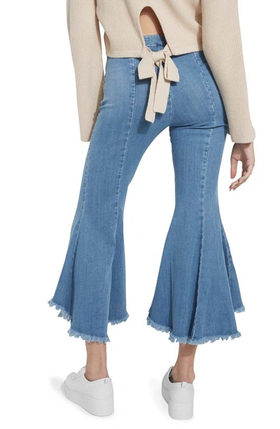 Shop Guess Sofia 1981 Frayed Ankle Flare Jeans In Blue