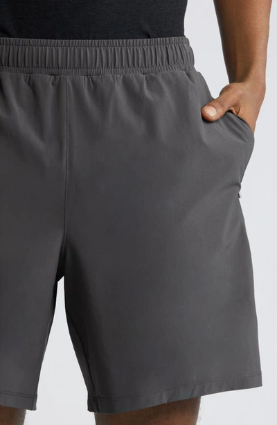 Shop Beyond Yoga Pivotal Lined Stretch Shorts In Graphite