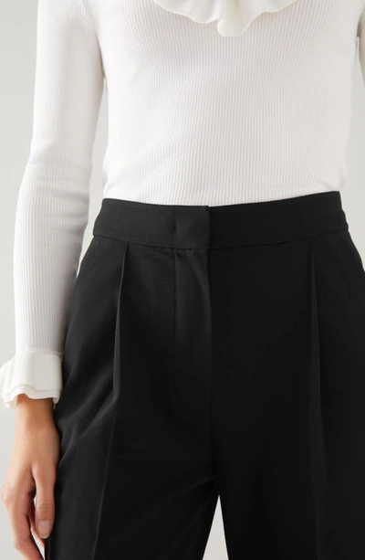 Shop Lk Bennett Lilly Pleated Tapered Crepe Pants In Black