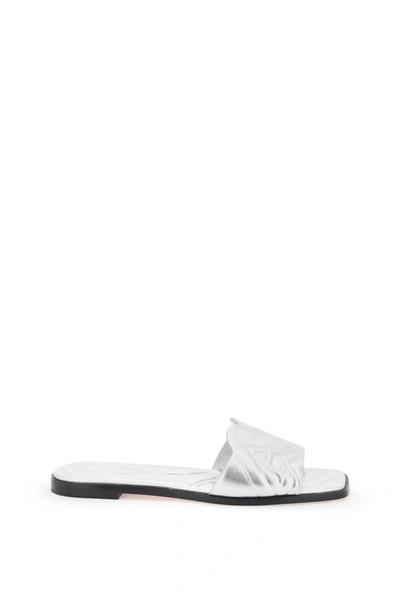 Shop Alexander Mcqueen Laminated Leather Slides With Embossed Seal Logo Women In Silver