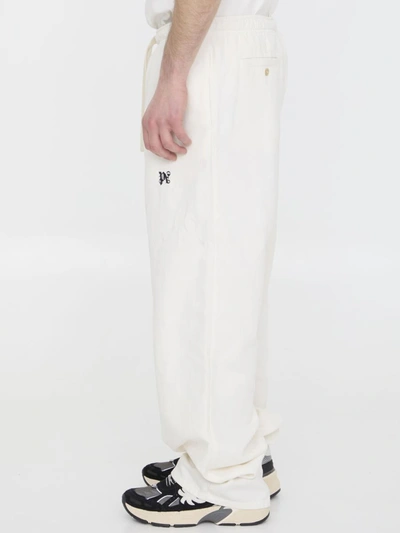 Shop Palm Angels Monogram Pants In White