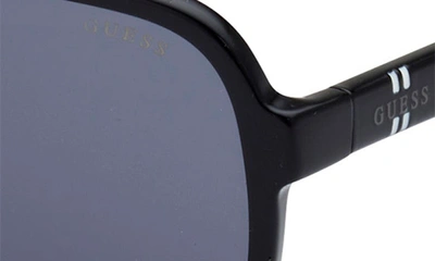 Shop Guess 61mm Pilot Sunglasses In Shiny Black / Smoke