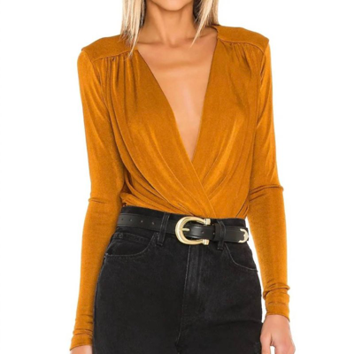 Shop Free People Turnt Bodysuit In Gold