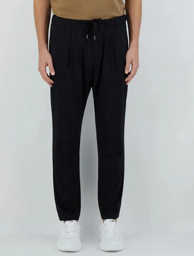 Shop Herno Trousers Black