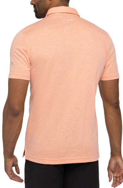 Travis Mathew Mucho Gusto Solid Polo Shirt In Heather Melon