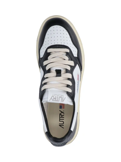 Shop Autry Sneakers In Black